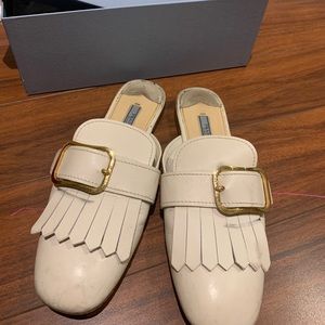 Prada mules in City Calf Leather with gold buckle